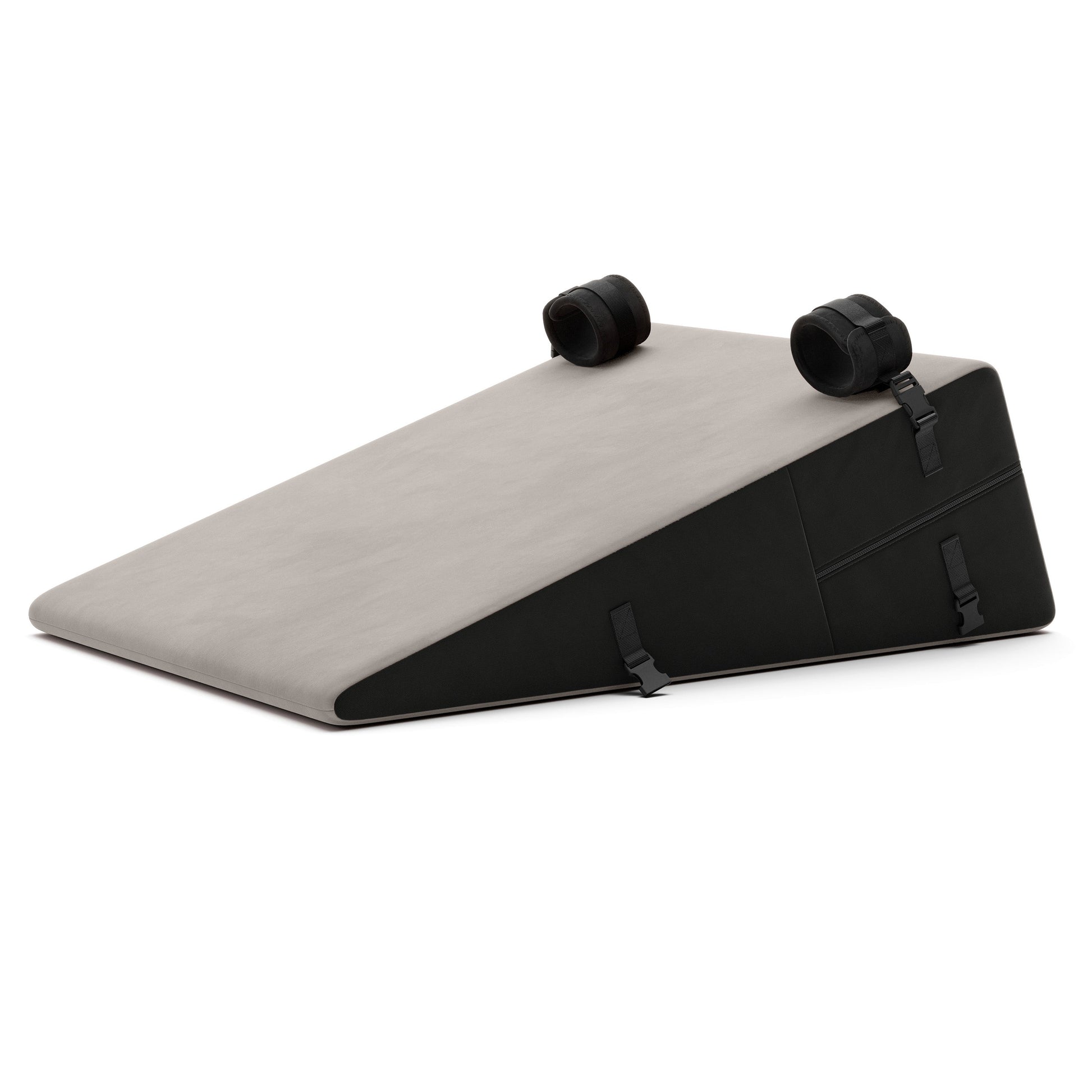 A grey Bondage ramp, Bedroom Furniture by Liberator with handcuffs on a white background.