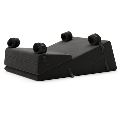 A set of black Bondage ramp and wedge, Bedroom Furniture by Liberator with handcuffs on a white background.