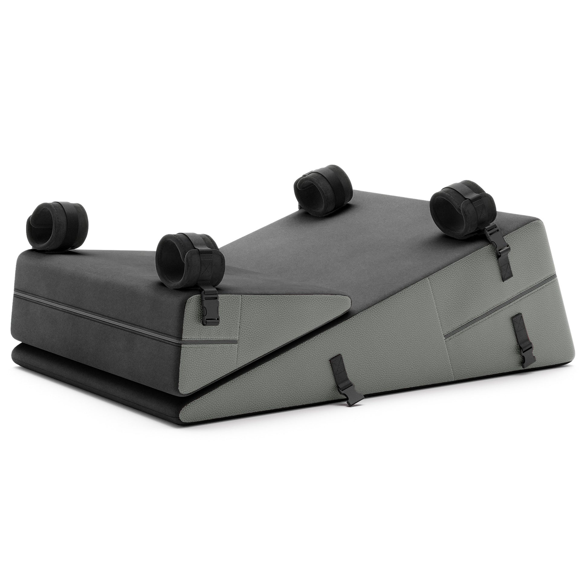 A set of grey ultraleather Bondage ramp and wedge, Bedroom Furniture by Liberator with handcuffs on a white background.