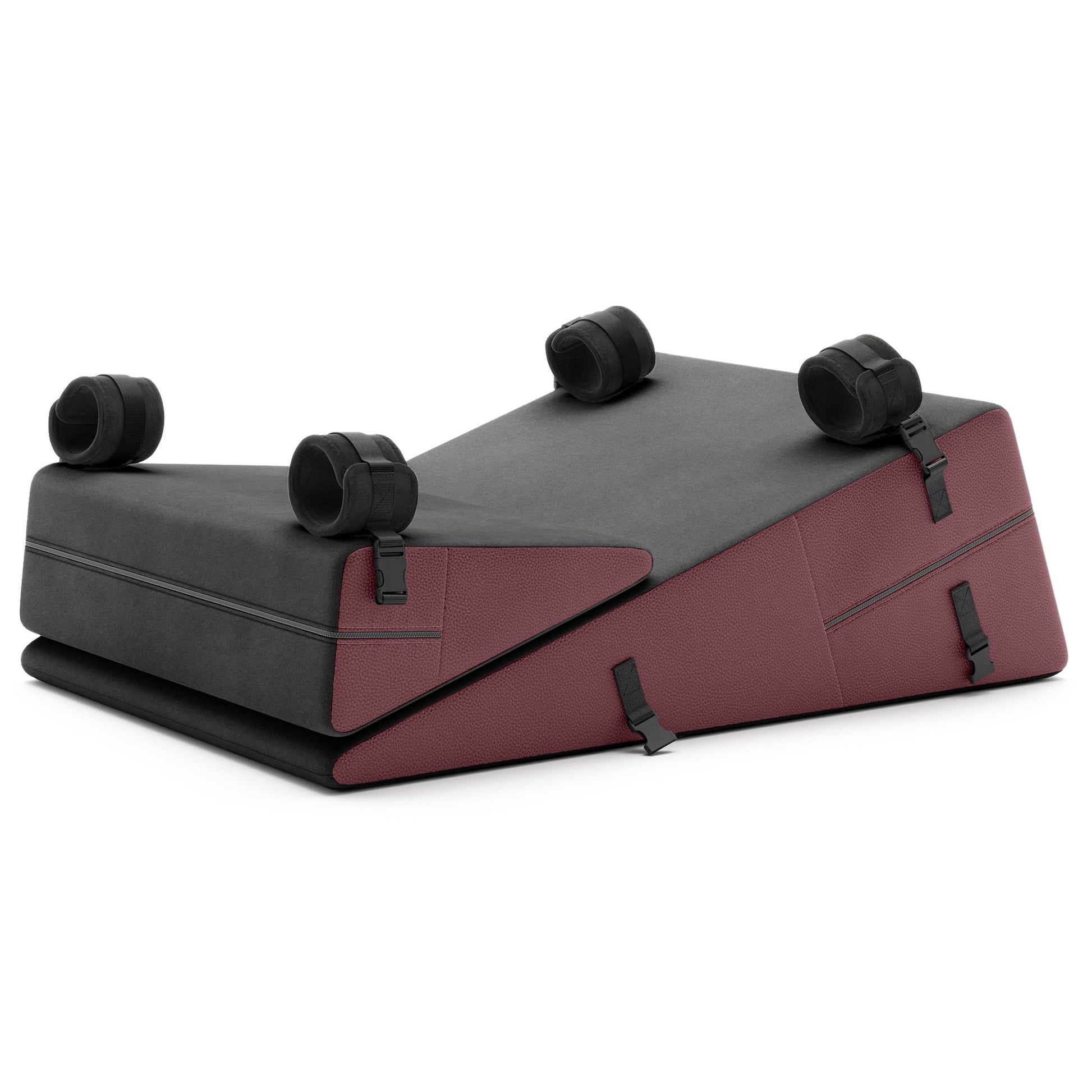 A set of Ultraleather raspberry Bondage ramp and wedge, Bedroom Furniture by Liberator with handcuffs on a white background.