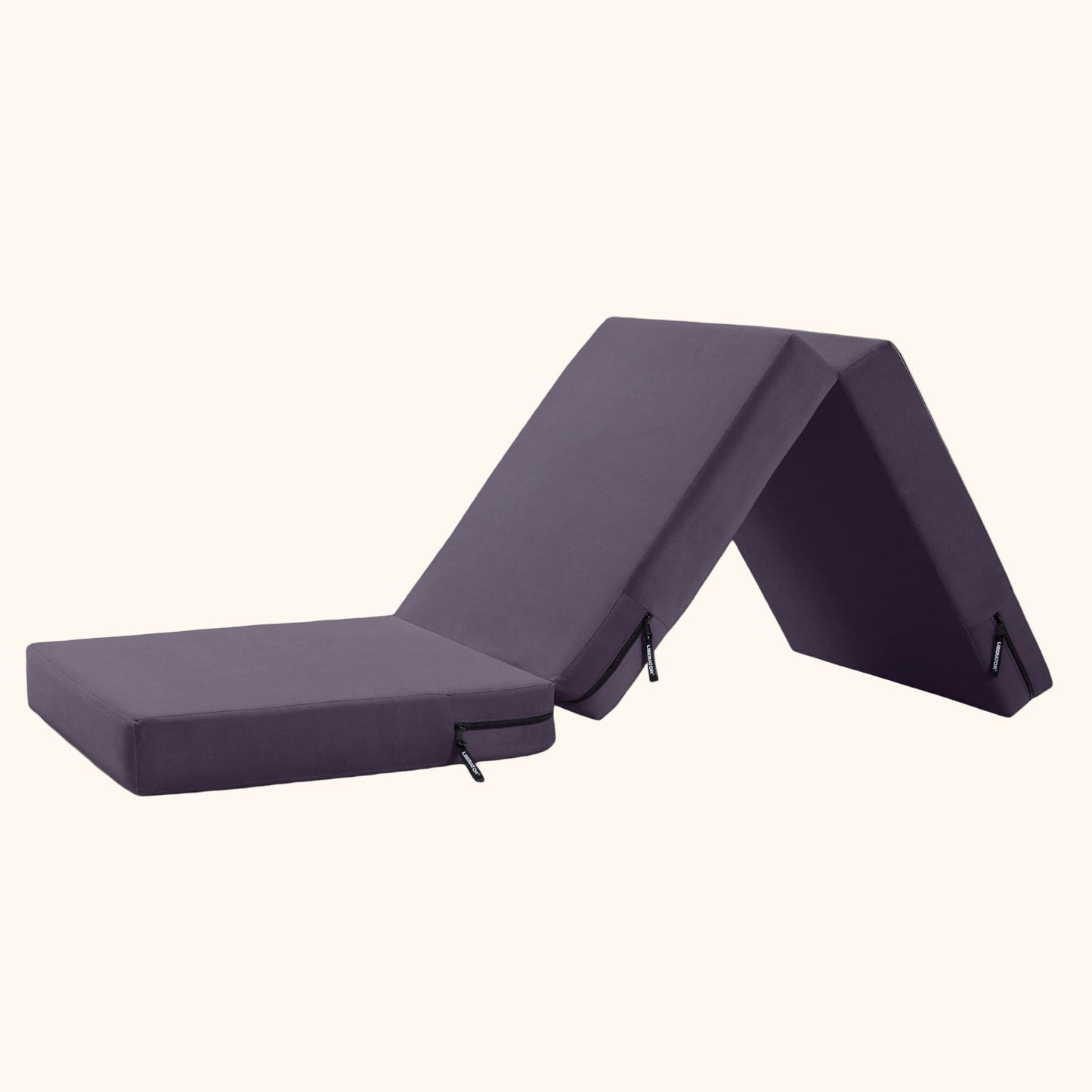 An Aubergine Center Stage ottoman, Bedroom Furniture unfolded by Liberator against a white background.