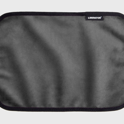 A black Fascinator Splashproof Throws, Bedroom Furniture by Liberator unrolled up against a white background.