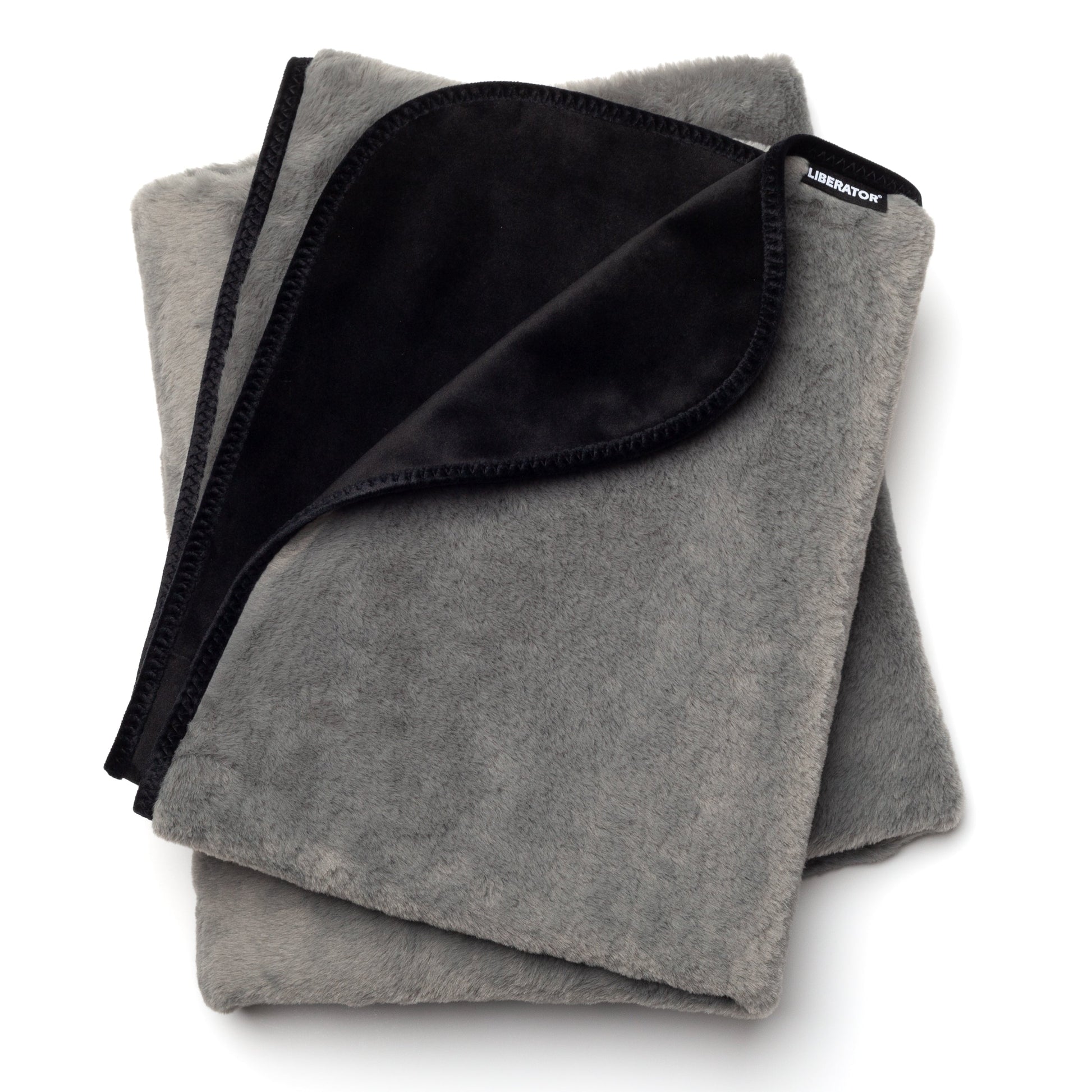 A grey faux fur Fascinator Splashproof Throws, Bedroom Furniture by Liberator against a white background.