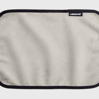 A white cream Fascinator Splashproof Throws, Bedroom Furniture by Liberator unrolled up against a white background.