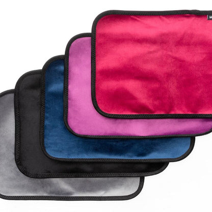 Five Fascinator Splashproof Throws in all the colors, Bedroom Furniture by Liberator against a white background.