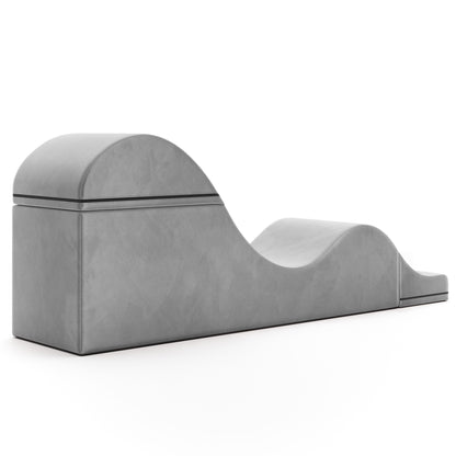 A grey Aria Flip Chaise by Liberator unfolded into a chaise against a white background.