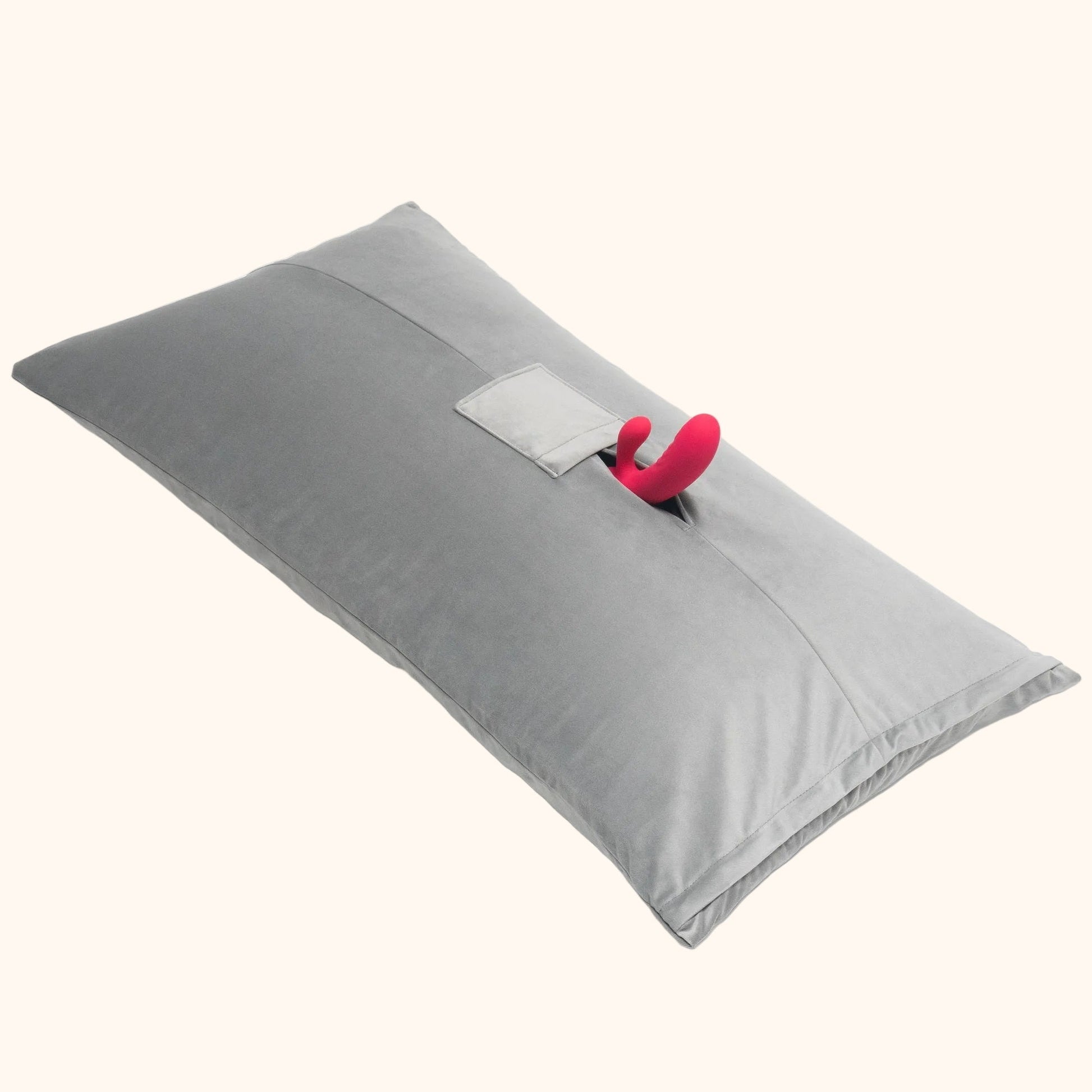 A grey Humphrey Toy Mount pillow, Bedroom Furniture with a toy in it by Liberator against a white background.