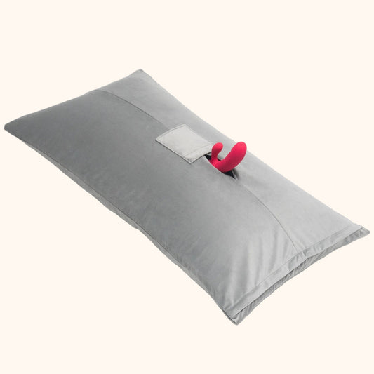 A grey Humphrey Toy Mount pillow, Bedroom Furniture with a toy in it by Liberator against a white background.