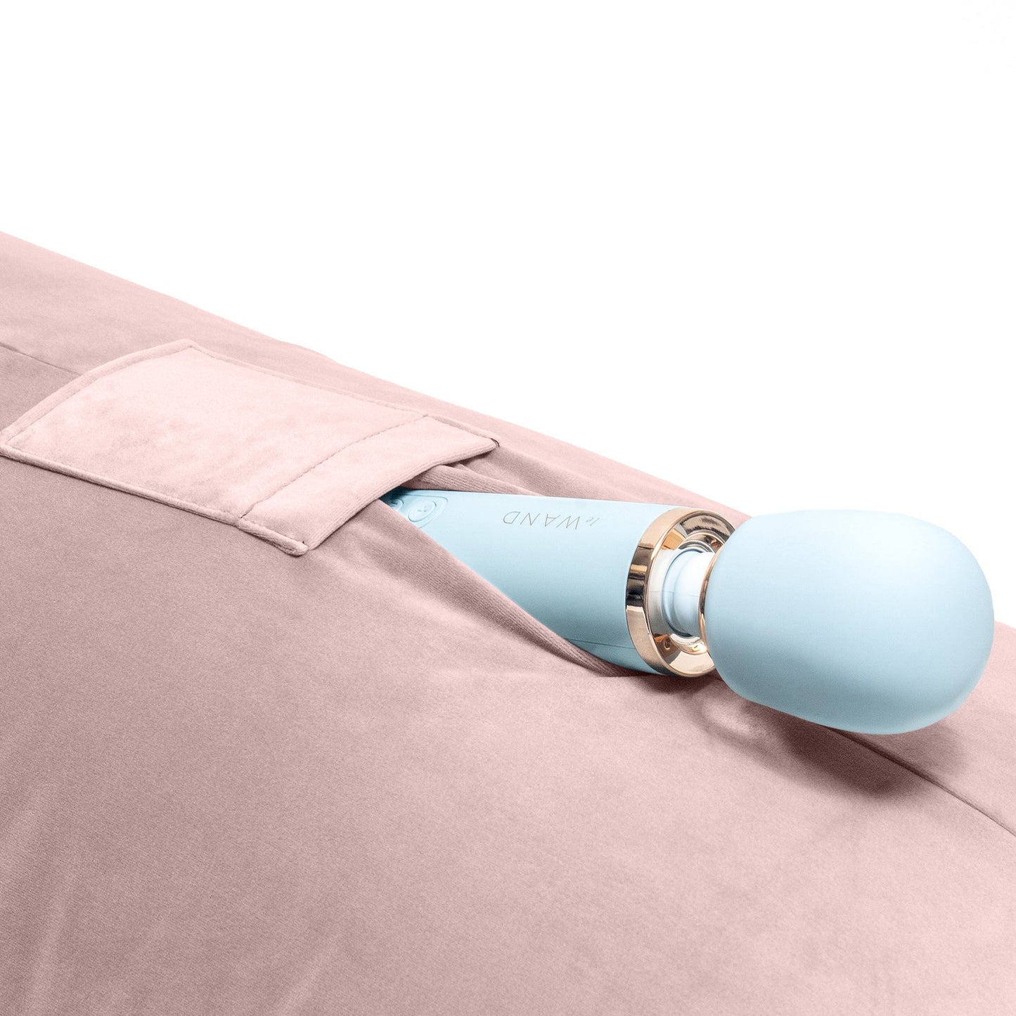 A close up of the mounting whole of a rose colored Humphrey Toy Mount pillow, Bedroom Furniture with a vibrator in it by Liberator against a white background.