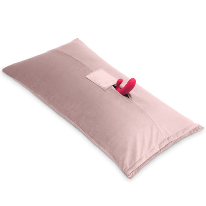 A rose colored Humphrey Toy Mount pillow, Bedroom Furniture with a toy in it by Liberator against a white background.