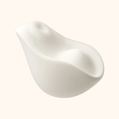 A white Kiss dual-tapping vibrator by Liberator against a white background.