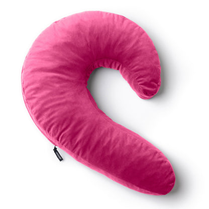A pink Lune Snuggle curved Pillow, Bedroom Furniture by Liberator against a white background.