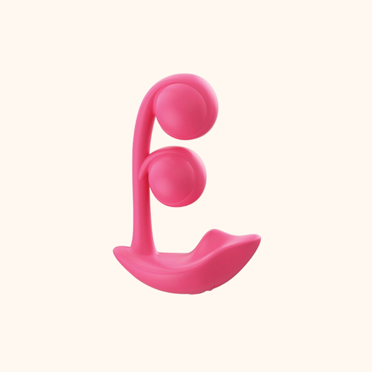 A pink Melody Wearable remote vibrator against a white background.