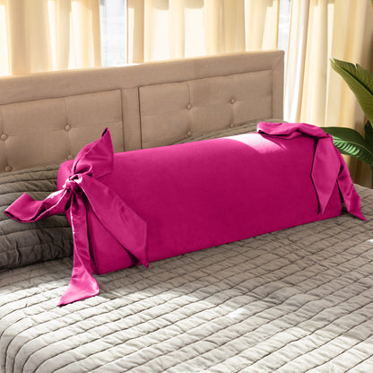 A pink Ravish Bondage Pillow, Bedroom Furniture by Liberator sitting on a bed.