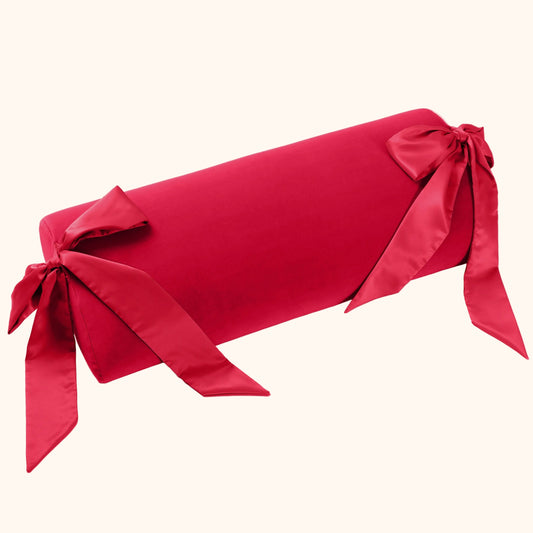 A red Ravish Bondage Pillow, Bedroom Furniture by Liberator against a white background.
