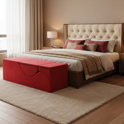 A Red Aria lounger by Liberator bench in front of a bed.
