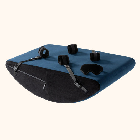 A Ink Blue Scoop Valkyrie, Bedroom Furniture by Liberator with cuffs against a white background.