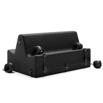 A black Steed Spanking Bench bedroom furniture by Liberator with cuffs against a white background.