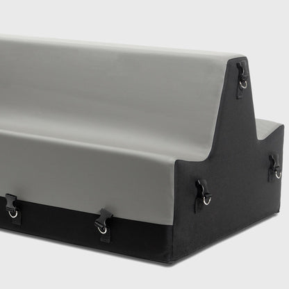 A grey and black Steed Spanking Bench bedroom furniture by Liberator  with cuffs against a white background showing the connectors where the cuffs attach.