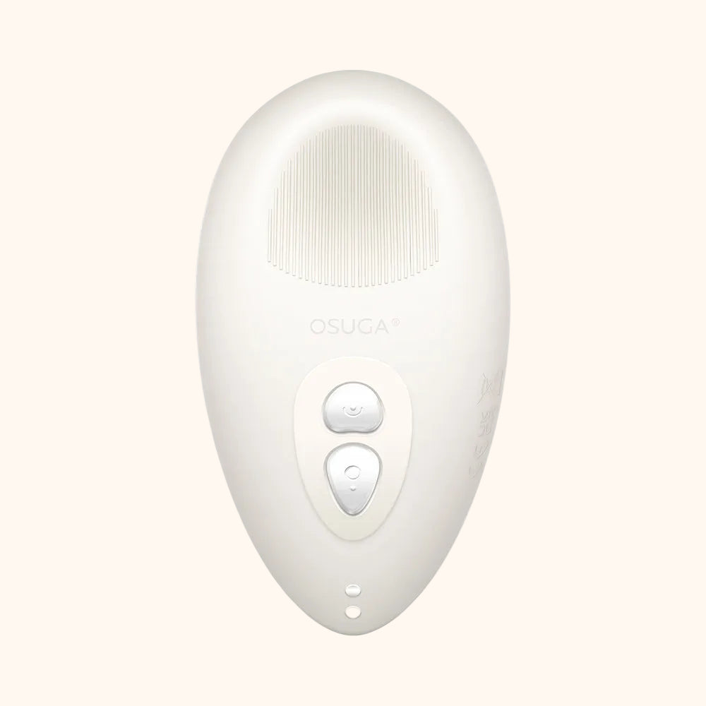 A white Tremble clitoral vibrator by Liberator against a white background.