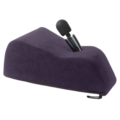 A aubergine Wanda Toy Mount, Bedroom Furniture by Liberator holding a wand.